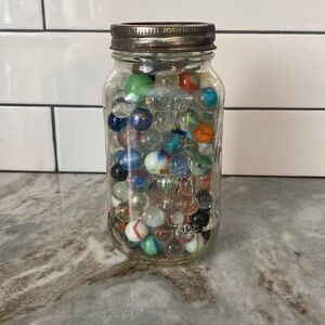 Vintage quart jar of vintage marbles. Colorful collectible